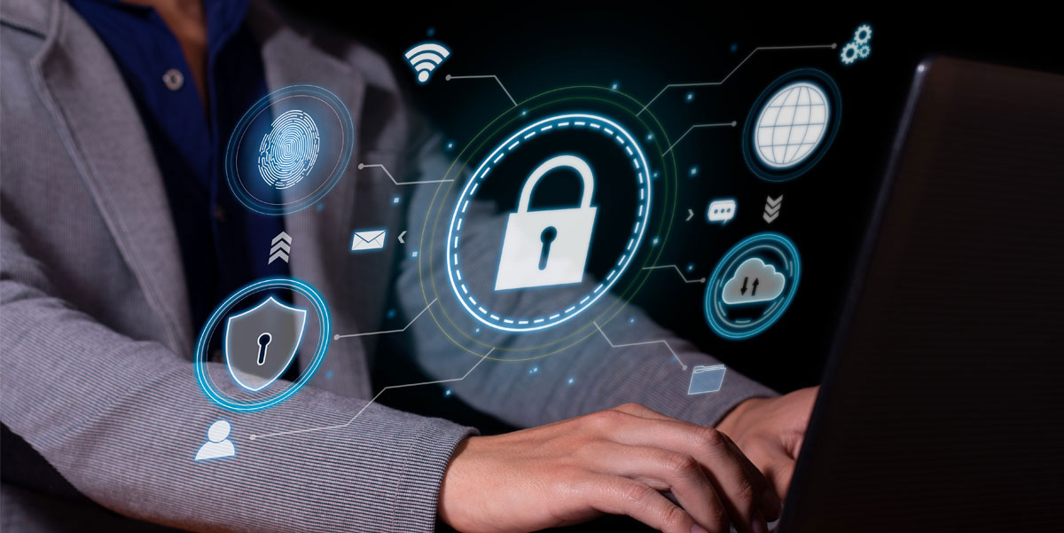 Illustration of security icons with a person working on a laptop