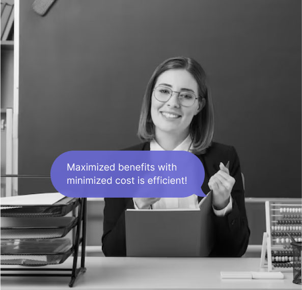 A professional woman sitting at her desk holding a book